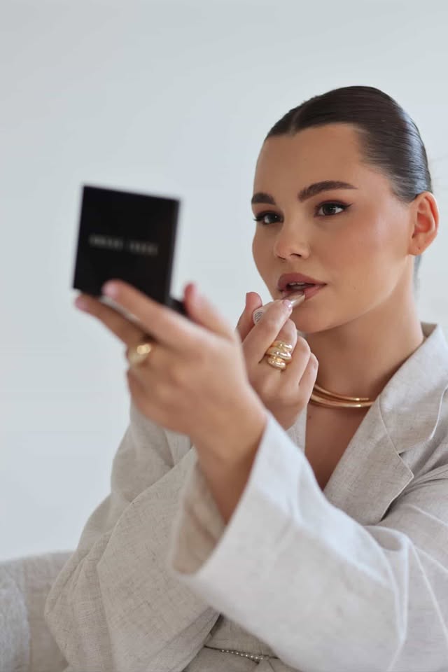 Anastasiia beauty artist applying lipstick